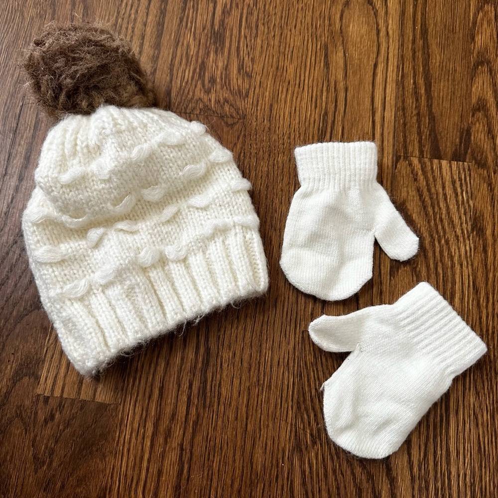 Ivory knit beanie hat with faux fur pom pom and matching mittens for baby